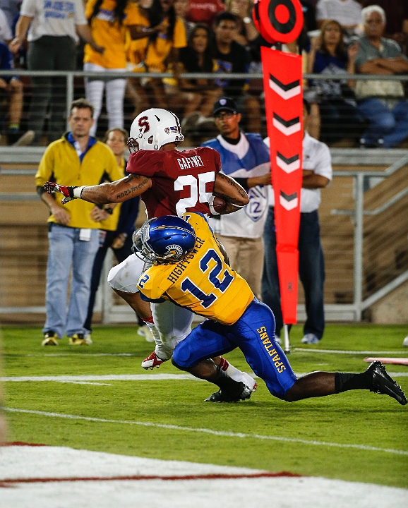 130907-Stanford-SanJose-010.JPG - Sept.7, 2013; Stanford, CA, USA; Stanford Cardinal running  back Tyler Gaffney (25) is bought down following a 16 yard touchdown by cornerback Forrest Hightower (12) against the San Jose State Spartans at  Stanford Stadium. 